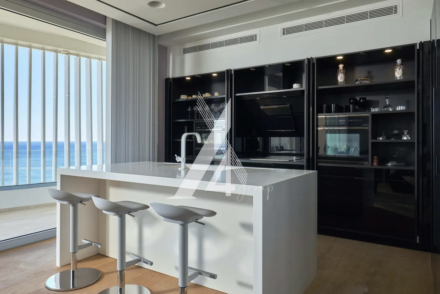 Hidden kitchen with island and sea view